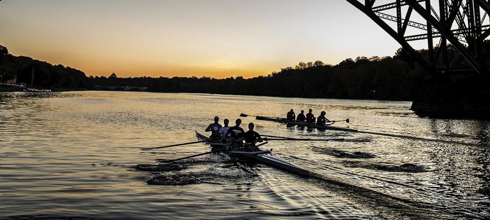 Rowing team out on the river at dawn